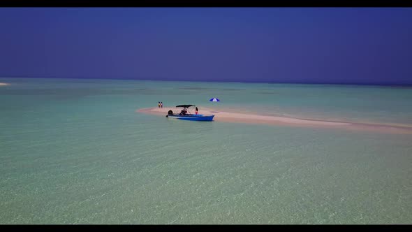 Aerial top view nature of relaxing coastline beach voyage by blue ocean with bright sand background 