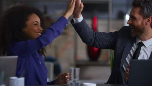 Business People Clapping Hands High Five Celebrate Deal on Multi Ethnic Meeting