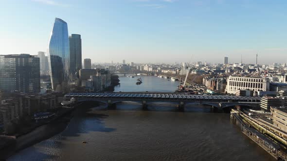 Aerial view of Blackfriars train station over river Thames on a hazy sunny day