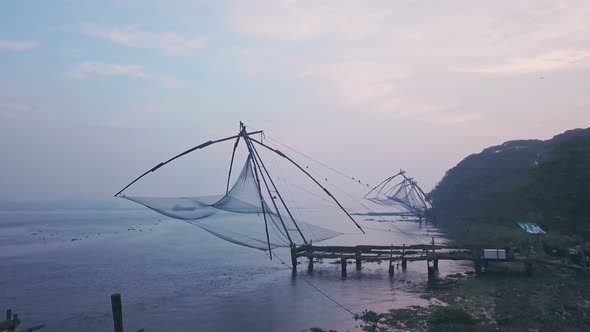 Traditional Chinese fishing nets, Fort Kochi, India. Aerial drone view at sunrise