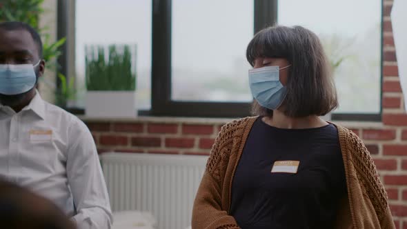 Close Up of Woman with Face Mask Attending Aa Group Therapy Session