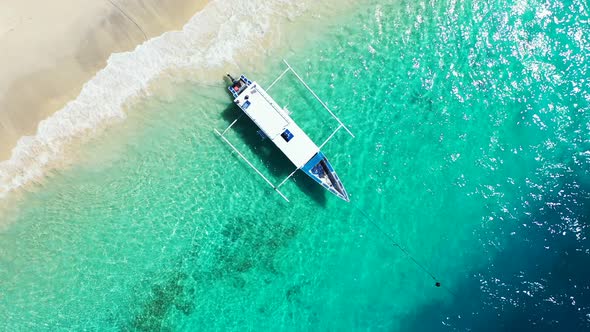 Natural birds eye travel shot of a sandy white paradise beach and blue ocean background in best qual