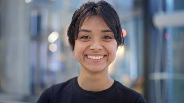 Portrait Close Up of Emotional Asian Girl Showing Her Tongue