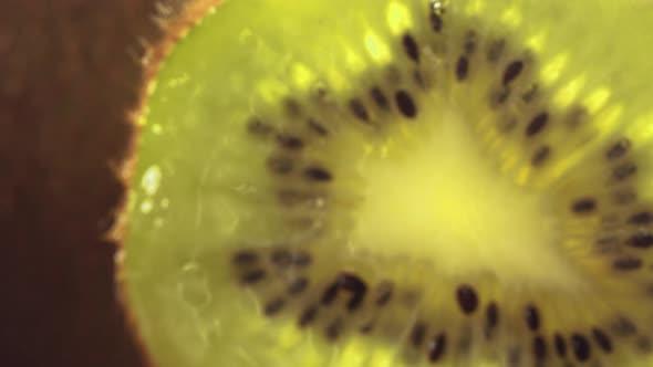 Rolling Half of Kiwi and Opening the Inside of the Fruit in Slow Motion