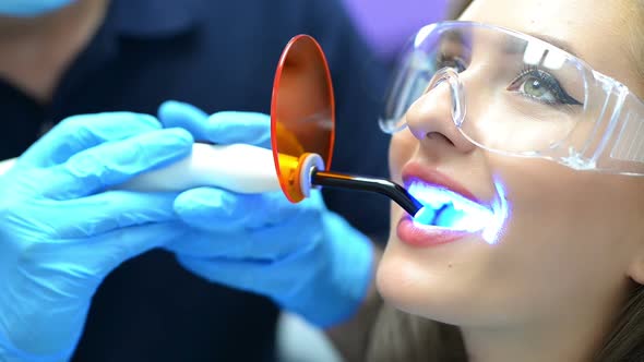 Dentist Using Ultraviolet Lamp
