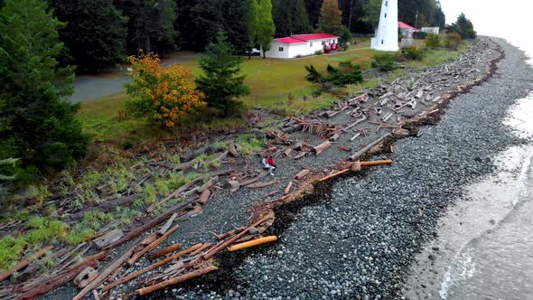 Vancouver Island Canada Quadra Island Old Historical Lighthouse at Cape Mudge Couple in Yellow Rain