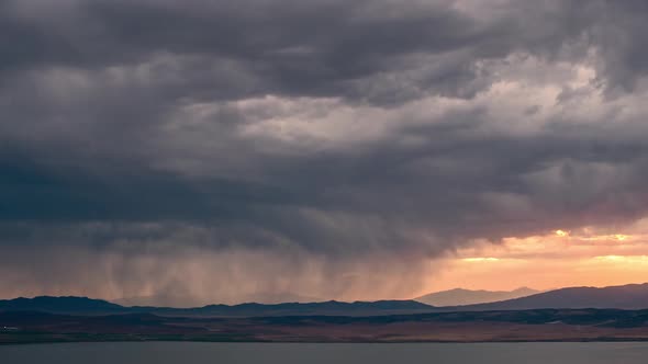 Time lapse of storm moving over the landscape at sunset
