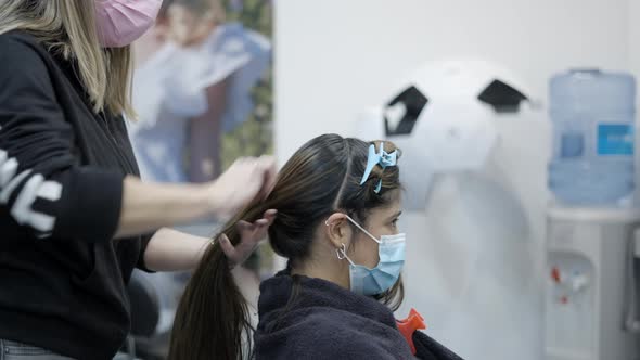 Hairdresser Making Hair Partitions to Dye Hair