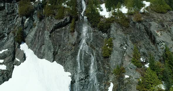 Flying Up Large Spring Waterfall Aerial Snowy Mountain Natural Environment