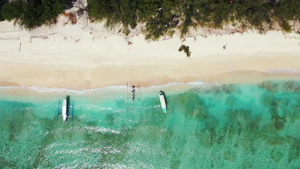 Aerial tourism of relaxing tourist beach time by aqua blue lagoon with white sandy background of a d