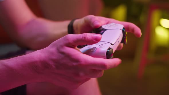 Man Gamer Hands Holding Modern Console for Play Station Closeup Guy Playing Video Games