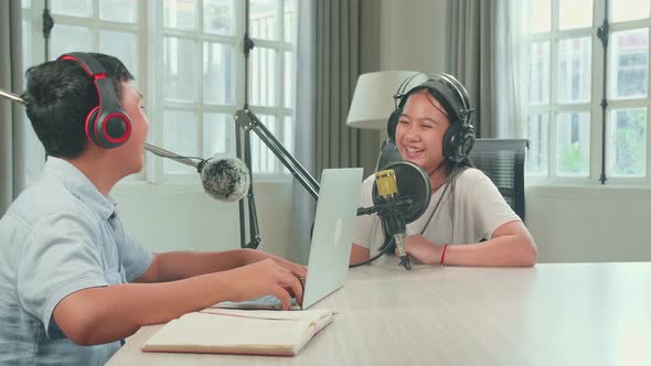 Happy Asian Boy Host Record Podcast With Laptop Interview Guest Conversation For Content