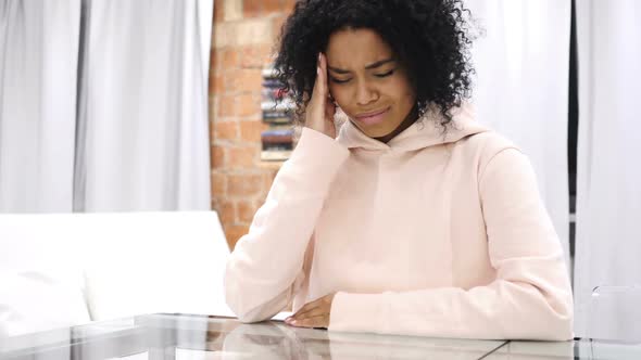 Headache Frustration for AfroAmerican Woman Working on Laptop