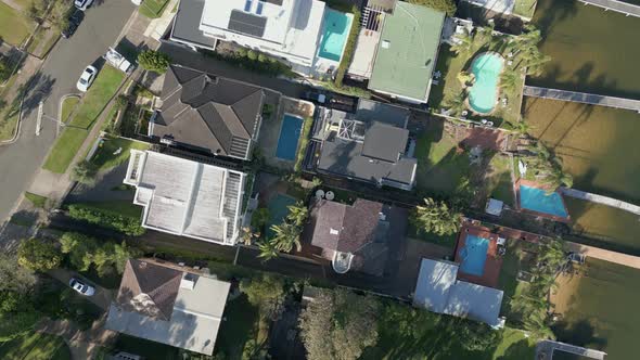 Aerial top down of residential properties, homes, houses. Luxury peaceful suburban living featuring