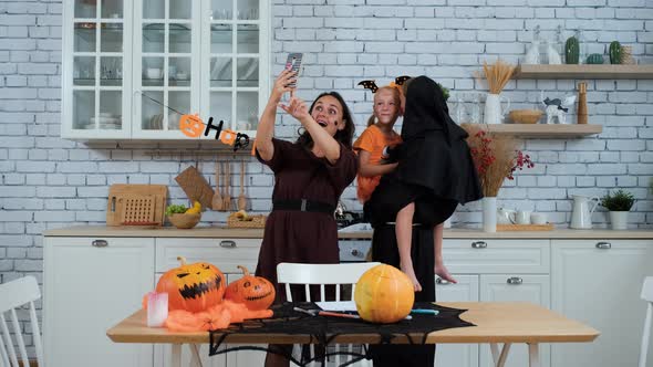 Family in Costumes Taking Selfie in Halloween