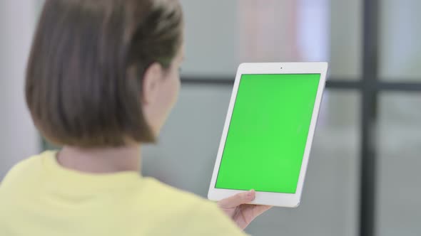 Young Woman Using Tablet with Green Screen