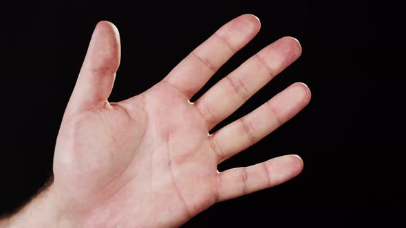 Human Hand Making Fingerprints on Black Background