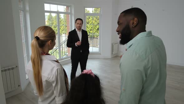 Positive Family Looking Around New House for Sale