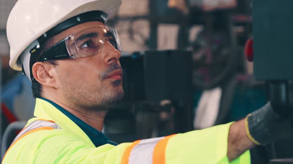 Smart Factory Worker Using Machine in Factory Workshop