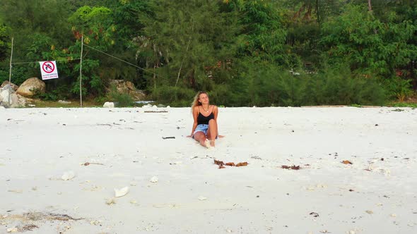 Sexy smiling ladies travelling spending quality time on beach on summer white sandy and blue 