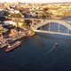 Drone Footage of People Walking Along the Ribeira Pier - VideoHive Item for Sale