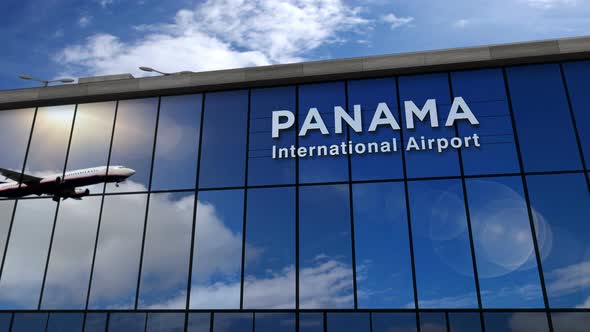 Airplane landing at Panama airport mirrored in terminal alt