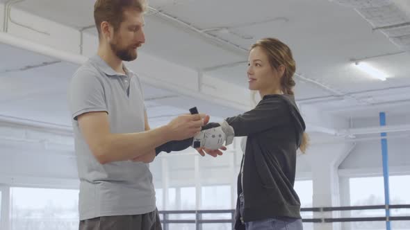 Female Rollerblader with Coach before Lesson