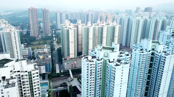 Fly drone over residential district in Hong Kong city