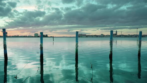 Venice Lagoon Water Under Cloudy Sky at Sunset in Chioggia