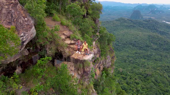 Dragon Crest Rock in the Jungle of Krabi Thailand Couple Men and Woman Looking Out Over Jungle