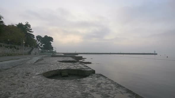 Concrete seashore and the sea