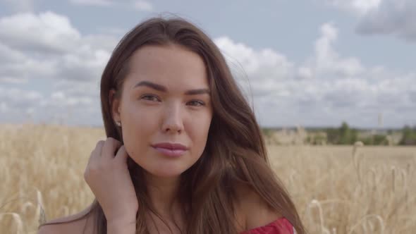 Portrait Charming Young Woman Enjoying Nature and Sunlight in Wheat Field at Incredible Colorful Sun