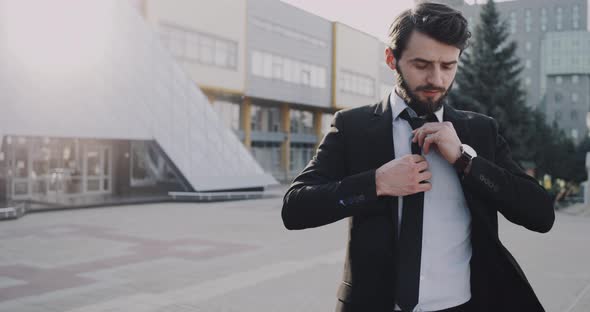 Young Businessman Waiting for a Meeting in Front