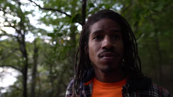 Portrait of African American Man While Exploring Trees and Nature