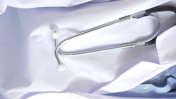 Close-up of a Doctor in a Medical gown, Hanging stethoscope, Vertical video