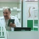 Senior Pharmacist Having Video Chat with Client Using Tablet Pc in Drug Store - VideoHive Item for Sale