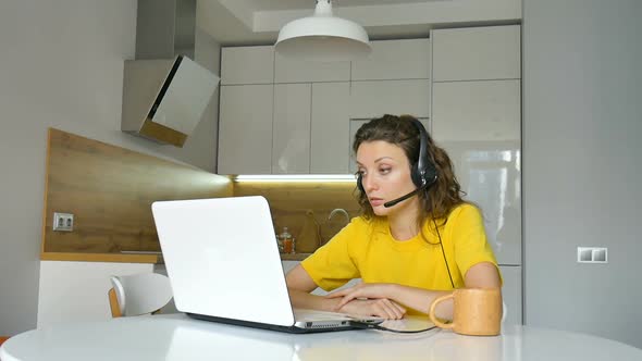 Young Woman is Having Online Meeting Using Her Laptop Businesswoman with Digital Tablet Sitting on