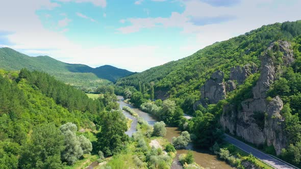 Panorama Aerial View On Road In Between The Mountains And River