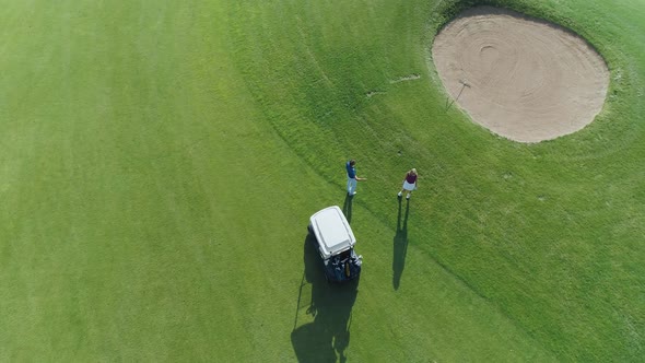 Summer Sunny Day Aerial View of Golf Course in Forest Area Golf Club Man and a Woman Explore a Golf