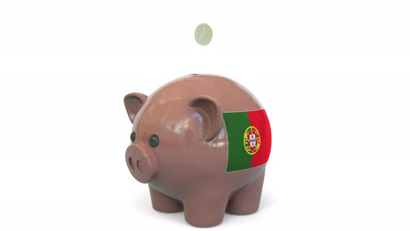 Putting Money Into Piggy Bank with Flag of Portugal