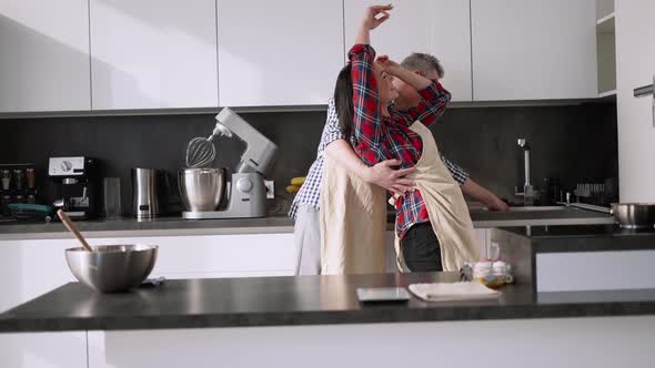 Loving Couple Dancing Romantic Dance on Date in Kitchen
