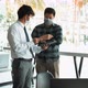 Asian colleague stood at the office and analyzed corporate data while wearing a face mask - VideoHive Item for Sale