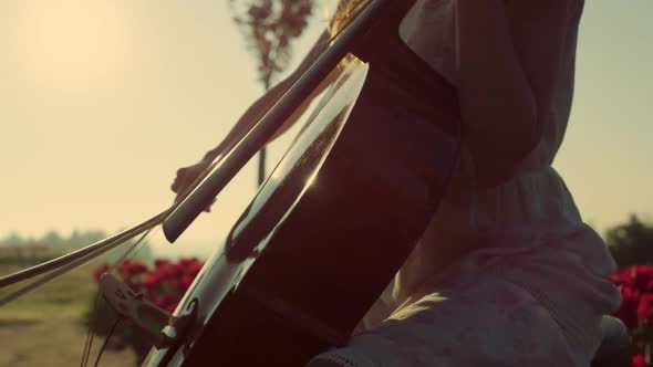 Closeup Unknown Girl Playing Cello in Blooming Summer Garden in Sun Reflection