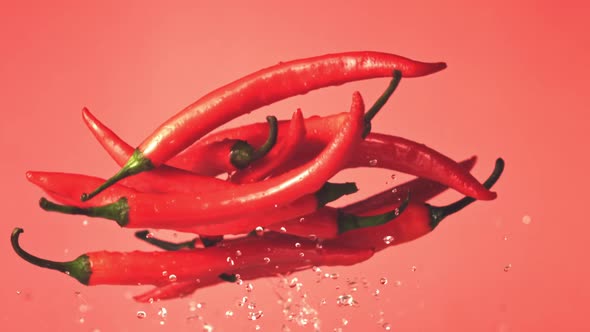 Super Slow Motion Chili Pods Rise Up with Drops of Water