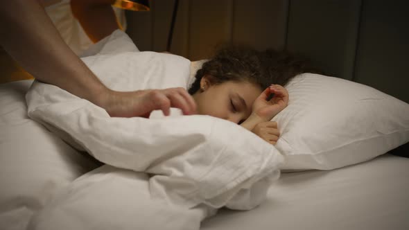 Child Little Baby Daughter Sleeps Sweetly in His Crib and Smiles in His Sleep