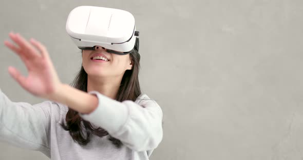 Woman playing game with VR device