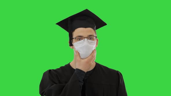 Graduate Student in a Medical Mask Walking on a Green Screen, Chroma Key