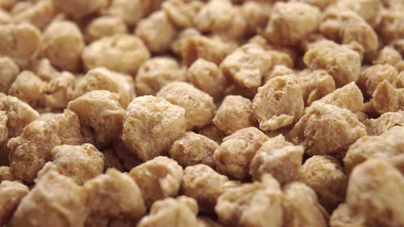 Raw soy flakes. Extreme close-up