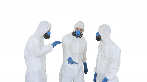 Medical Team in Protection Clothes Stacking and Rising Hands Teamwork Concept on White Background