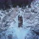 Drone view of frozen waterfall with some water running through - VideoHive Item for Sale